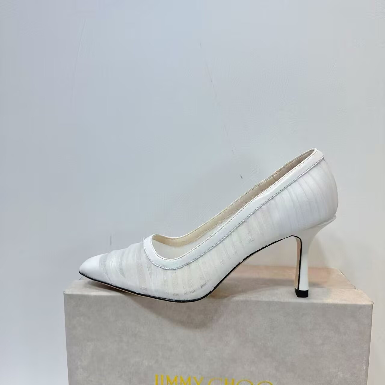ua Ji*y Ch* ivory tulle and nappa pumps
