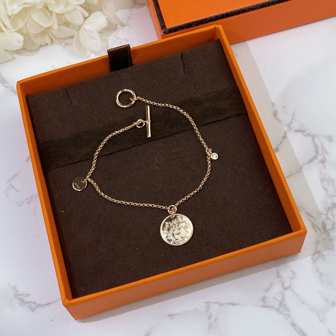 H**mes coin bracelet