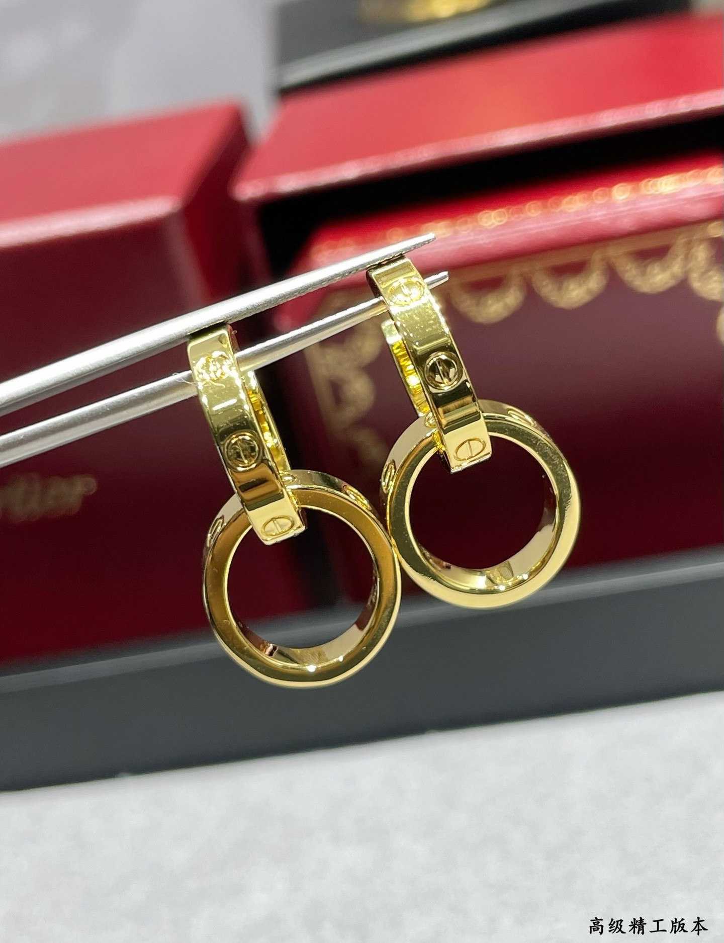 Ca*t*er double ring polished earrings