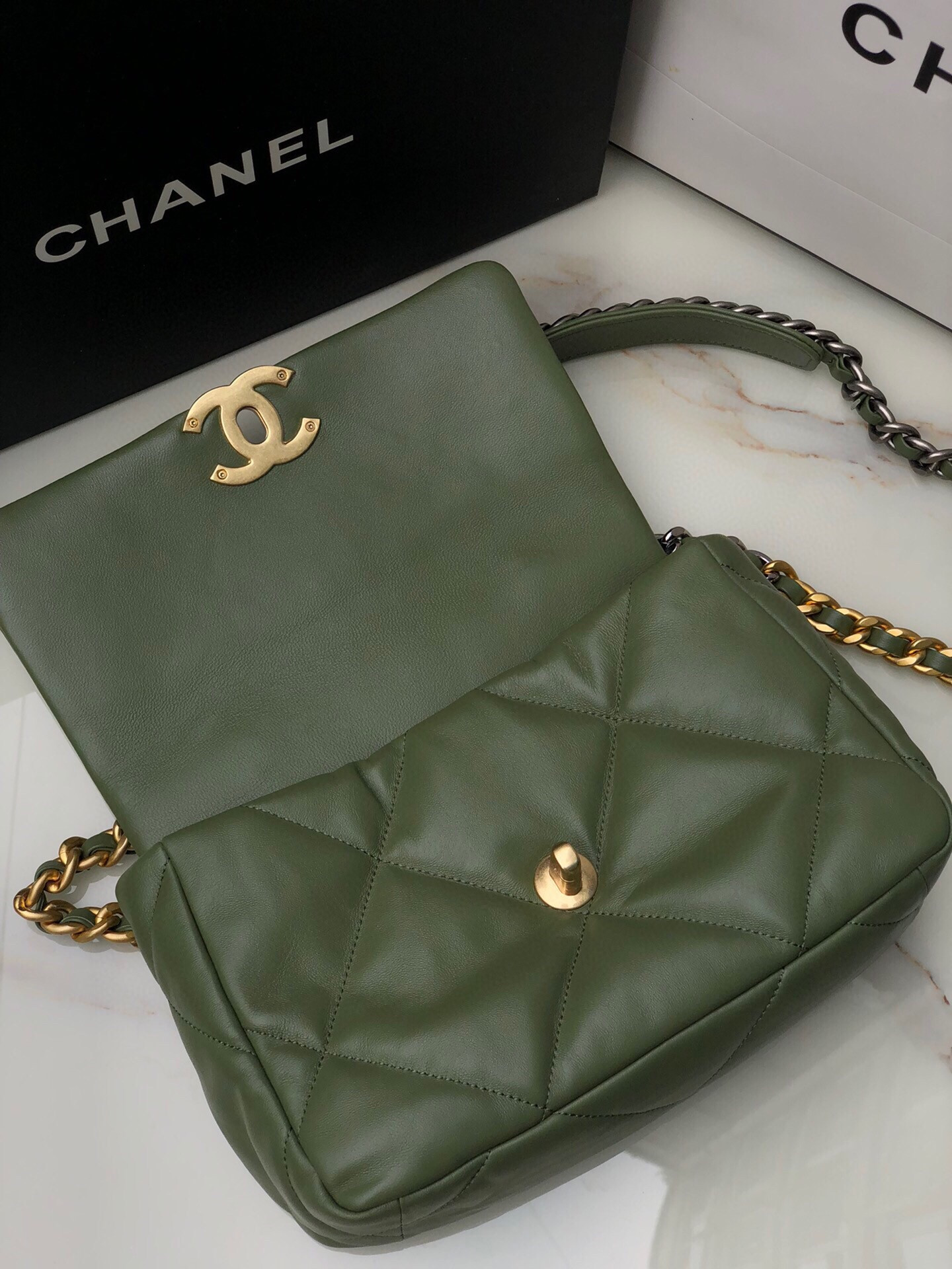 Ch*el 19 handbag shiny leather, gold-tone 16×26×9cm