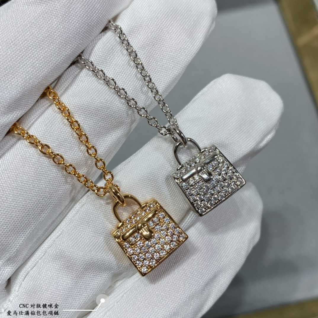 H**mes fully di*m*nd-encrusted bag necklace