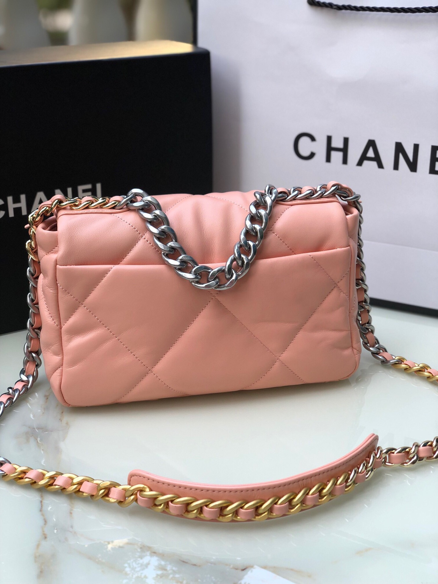 Ch*el 19 handbag shiny leather, gold-tone, silver-tone & ruthenium-finish metal light pink 6.2 × 10.1 × 3.5 in