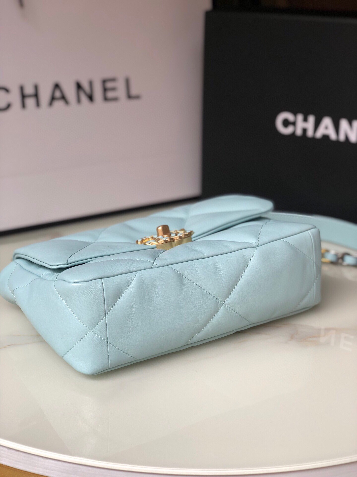 Ch*el 19 handbag shiny leather, gold-tone, silver-tone & ruthenium-finish metal light blue 6.2 × 10.1 × 3.5 in