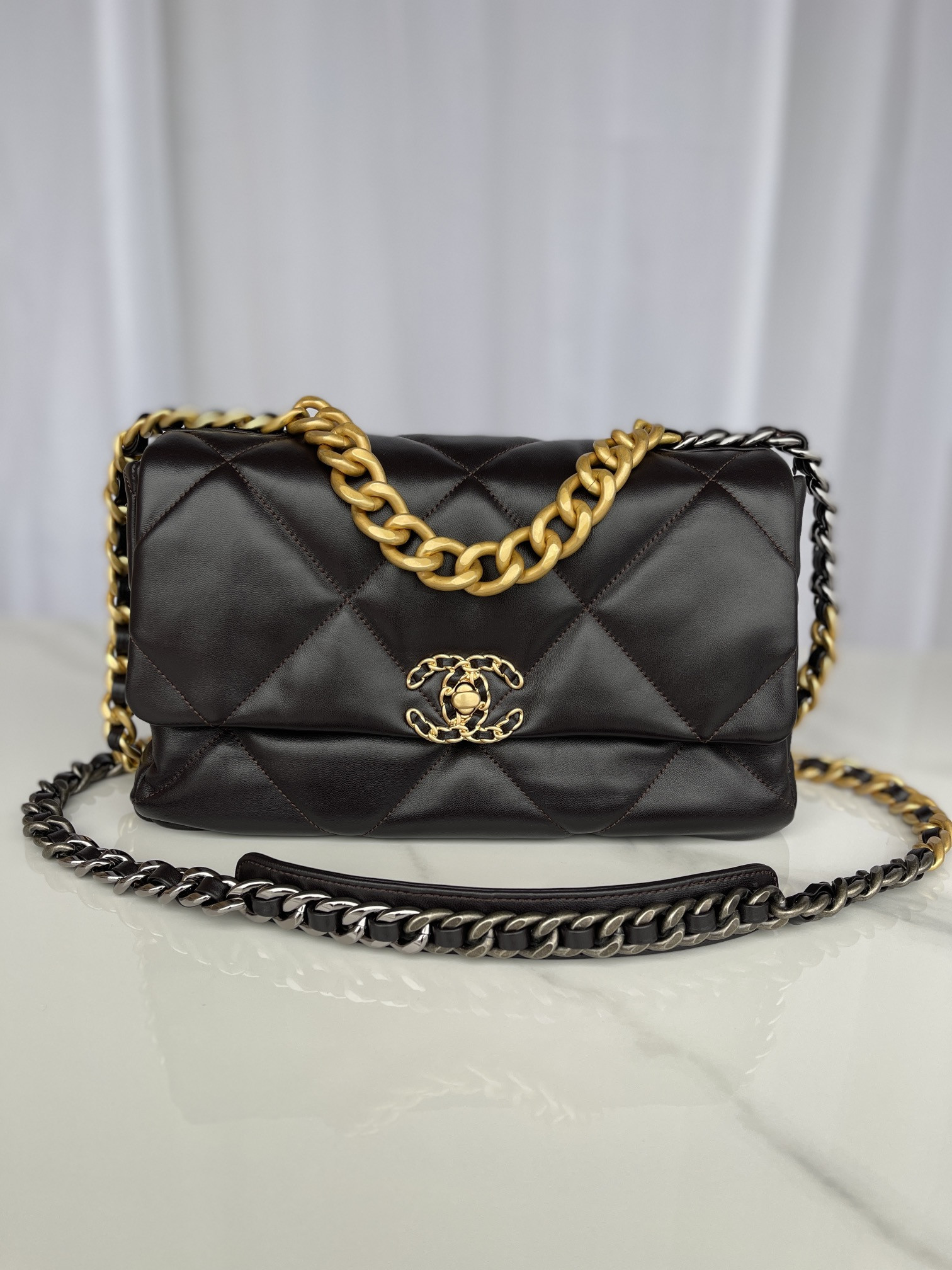 Ch*el 19 large handbag shiny leather, gold-tone, silver-tone & ruthenium-finish metal black 7.8 × 11.7 × 3.9 in