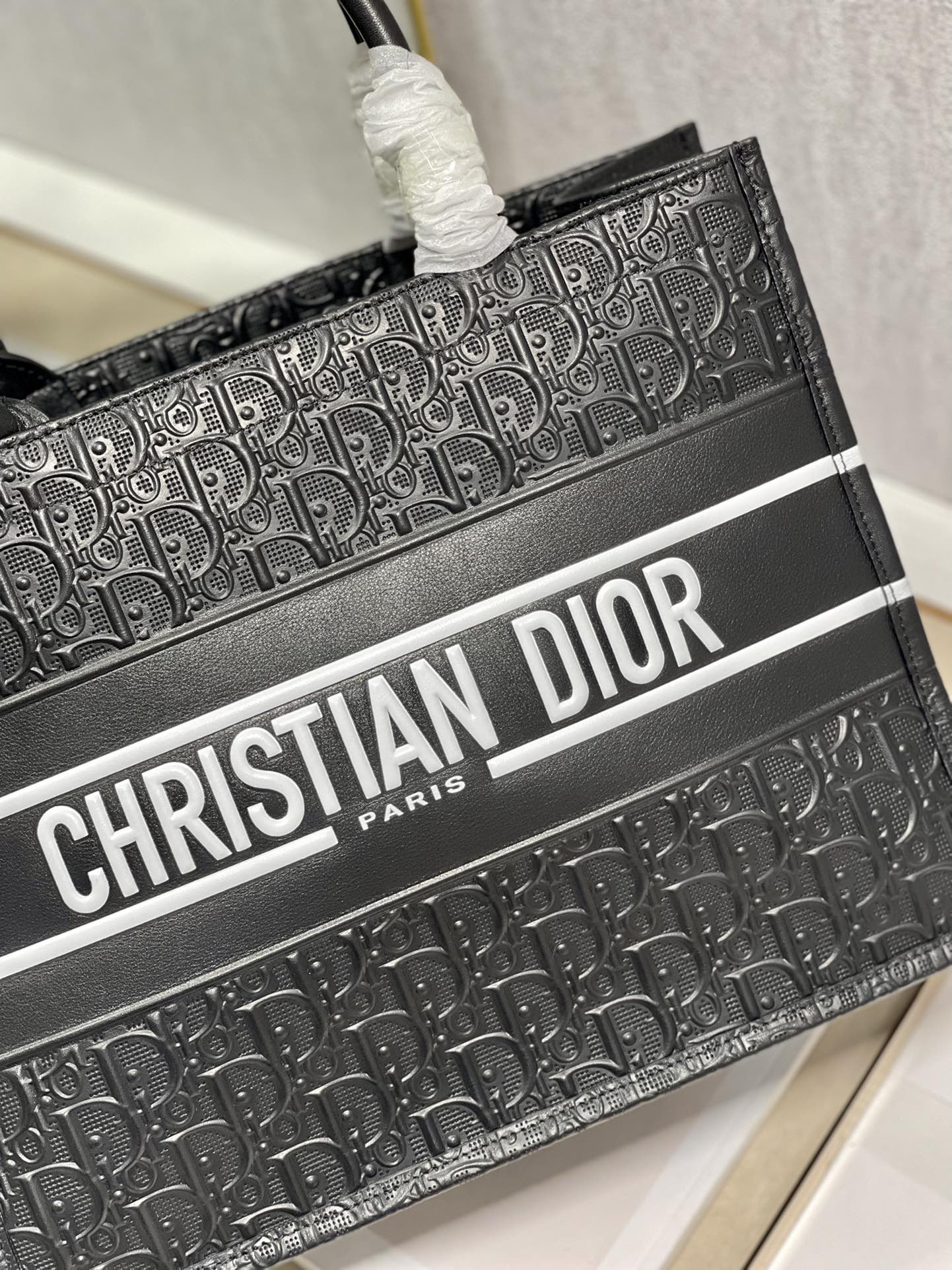 calfskin embossed medium D*or book tote black white 14 x 11 x 6.5 inches