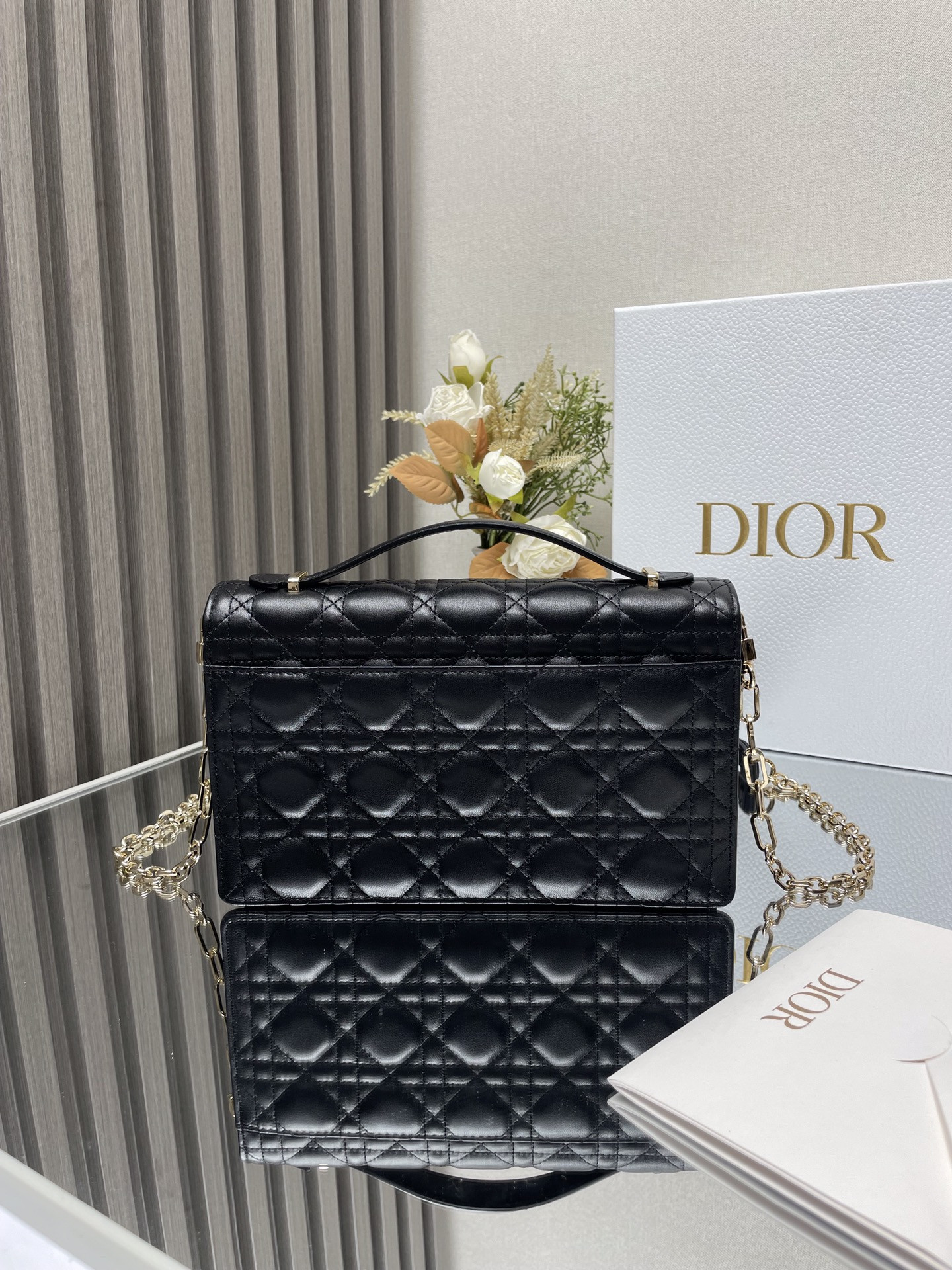 my D*or top handle bag black 9.5 x 5.5 x 3 inches