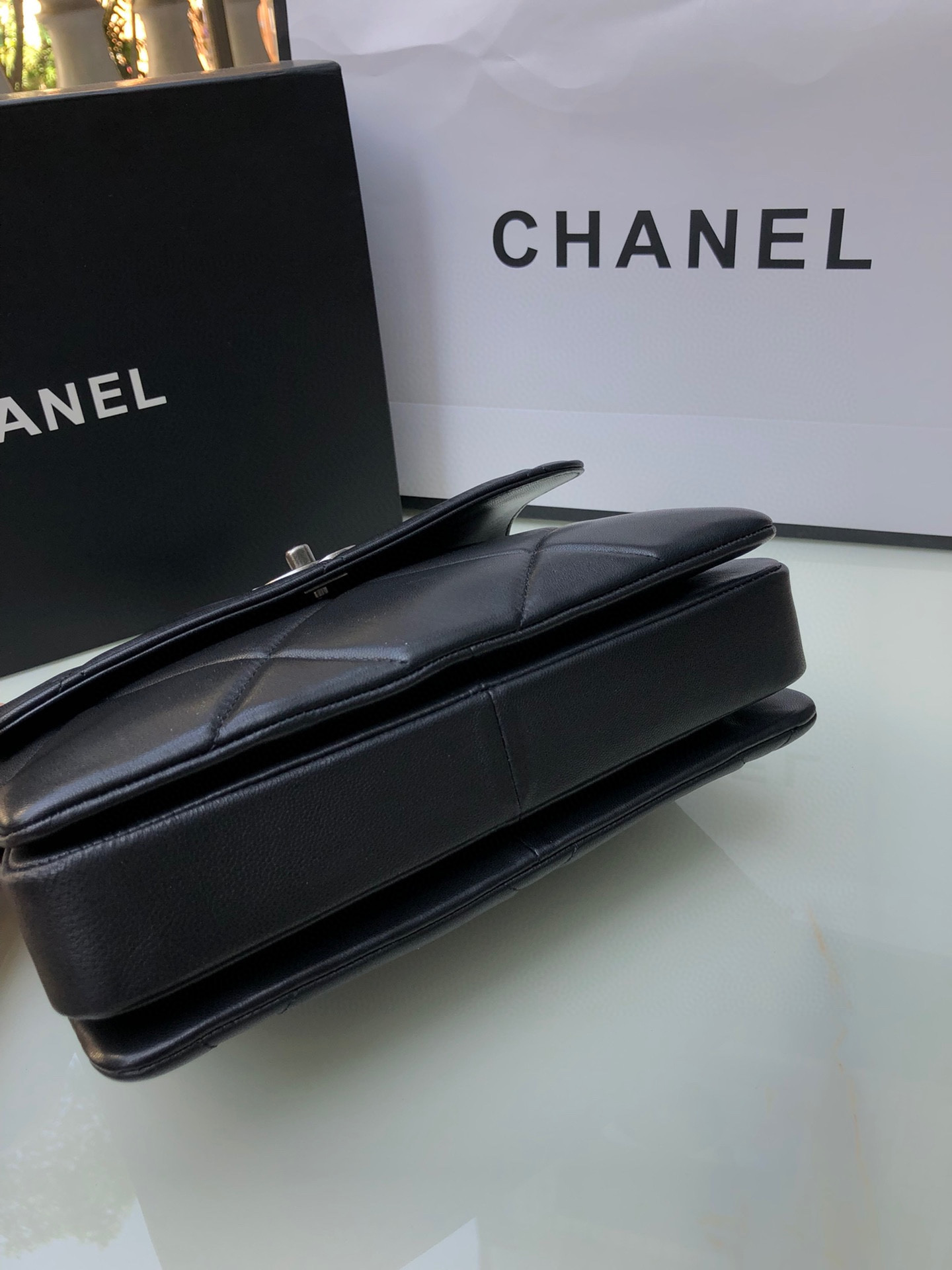 Ch*el flap bag with top handle 6.6 × 9.8 × 4.7 in
